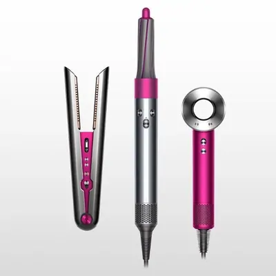 Hair styling tools: a straightener, a multi-styler and a hair dryer in pink and silver